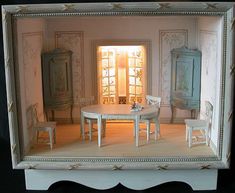 a doll house with furniture and accessories in it