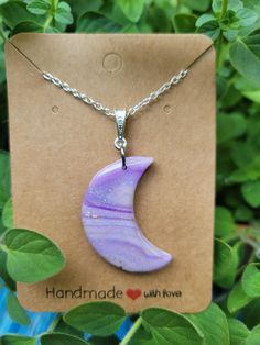 Sparkling purple moon pendant made with polymer clay and resin.  This pendant is lightweight and sparkles in the light!  It's one of a kind and made by me in my studio!  Get one before it's gone!   Use a damp cloth to clean. Handmade Purple Resin Necklace, Handmade Purple Moon-shaped Jewelry, Purple Moon Charm Pendant Necklace, Purple Pendant Necklace With Moon Charm, Moon Pendant, Lavender, Moon, Polymer Clay, Jewelry Necklace Pendant