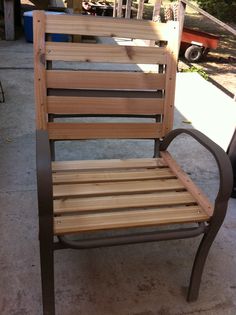 a wooden chair sitting on top of a sidewalk