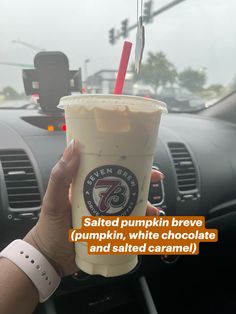 someone holding up a cup of coffee in their hand with the words salted pumpkin brown pumpkin white chocolate and salted caramel