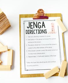 a piece of paper that has been placed on top of some wooden blocks and is next to a clipboard with instructions