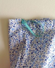 a blue and white bag sitting on top of a table