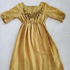 Matta Womans Silk Gold/Yellow Dress Size Small. 38" Length The Waist Does Stretch 100% Silk Scoop Neck Knee Length Yellow Raw Silk Dress With Intricate Embroidery, Yellow Bohemian Knee-length Midi Dress, Mustard V-neck Bohemian Dress, Yellow Dress, Red Yellow, Red Gold, Knee Length, Silk, Yellow