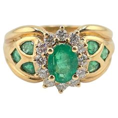 This is a fantastic 14 karat yellow gold ring with fabulous emeralds and diamonds. The emerald has a nice rich, vibrant green color, and the diamonds are all very clean and good color VS to SI quality. The weight of the ring is 6.01 grams and the ring size is size 6. The condition is excellent and it is ready to go, if you have any questions or any concerns, please ask Luxury Green Diamond Ring Stamped 14k, Multi-stone Green Diamond Ring In 14k Gold, Green Multi-stone Diamond Ring In 14k Gold, Green Multi-stone 14k Gold Diamond Ring, Classic Green Multi-stone Emerald Ring, Green Emerald Ring Stamped 14k Fine Jewelry, Fine Jewelry 14k Stamped Green Emerald Ring, Green Diamond Ring Stamped 14k For May Birthstone, Green Diamond Rings Stamped 14k