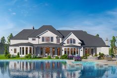 a large white house sitting next to a pool in front of a lush green field