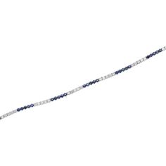 This 14K White Gold Sapphire and Diamond Tennis Bracelet features 36 round cut sapphires totaling 2.5 carats and 35 round cut diamonds totaling 1.77 carats. Each gemstone is securely held in place with a 4-prong setting.  This bracelet measures 7 inches in length and 2.3mm width and weighs 8.14 grams, and is secured with a box clasp.  Details:   Item Type: Tennis Bracelet  Metal: 14K White Gold  Weight: 8.14 Grams   Length: 7 inches  Width: 2.3mm  Setting: Prong  Clasp: Box  Stone Details:  Gemstone: Sapphire  Cut: Round  Quantity: 36  Carat: 2.5 CTTW  Color: Blue  Secondary Stone Details:  Gemstone: Diamonds  Cut: Round  Quantity: 35  Carat: 1.77 CTTW  Color: White Blue Diamond Bracelet In Prong Setting, Blue Diamond Bracelet With Prong Setting, Blue Diamond Bracelet With Brilliant Cut, Blue Brilliant Cut Diamond Bracelet, Blue Fine Jewelry Bracelet With Single Cut Diamonds, White Gold Sapphire Tennis Bracelet With Brilliant Cut, Blue Round Tennis Bracelet With Prong Setting, Sapphire Brilliant Cut Tennis Bracelet, Sapphire Brilliant Cut Diamond Bracelet