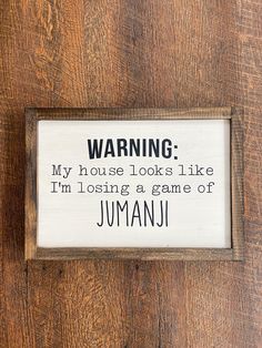 a sign that reads warning my house looks like i'm losing a game of jumanu