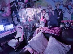 a bedroom with anime wallpaper and stuffed animals on the bed in front of it