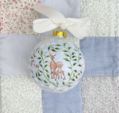 a christmas ornament with a deer on it