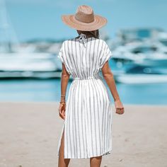 Elevate your beach look with our Striped Midi Cover-Up Dress - featuring a classic striped design and chic midi length, it's the perfect piece to take you from the sand to seaside cocktails in style! Whether you're strolling along the shore or sipping cocktails by the pool, this dress is sure to make a statement and keep you feeling fabulous all summer long. Product code: CAA07B3E28CA,CAA07B3E28AC/CAA07B3E28GG,CAA07B3E28DC,CAA07B3E28MC,CAA07B3E28SC Summer Poolside Maxi-length Cover-up, Breezy Maxi-length Beach Season Cover-up, Breezy Maxi Length Beach Cover-up, Chic Striped Beach Cover-up Dress, Striped Maxi Length Beach Cover-up Dress, Beach Look, Cover Up Dress, Dolman Sleeve, Stripes Design