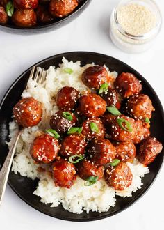 two plates with meatballs and rice on them next to a bowl of seasoning