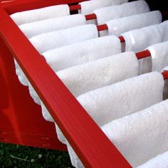 a red wagon filled with lots of white towels