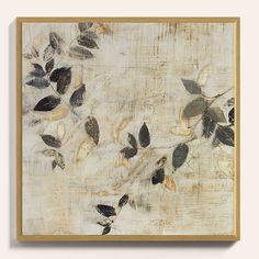 a painting with leaves on it in a wooden frame