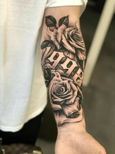 a person with a rose tattoo on their arm