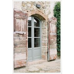 an old door and window with shutters open