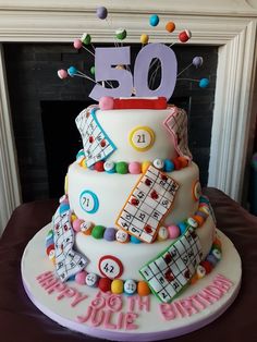 a 50th birthday cake decorated with colorful decorations