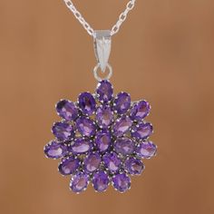 Sparkling brilliantly, 22 carats of faceted oval amethyst form a camellia flower as the pendant of this sensational necklace. Alok Jain presents the necklace, which is crafted of rhodium plated sterling silver and centers a classic cable chain. Fall Purple, Blue Topaz Pendant Necklace, Amethyst Pendant Necklace, Amethyst Necklace Pendant, Necklace Purple, Blue Topaz Pendant, Purple Jewelry, Purple Necklace, Ruby Pendant