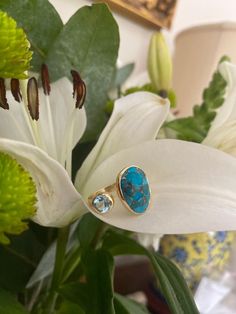 A striking copper turquoise and blue topaz make a wonderful combination in this open adjustable ring. This gemstone design strikes a unique balance between a bold statement and subtle elegance, it is particularly comfortable to wear. The ring is made from 18ct gold vermeil and has an open design to allow it to adjust as your finger adjusts in size. The ring is available in Size K (5.5) Size L (6) Size M (6.5) Size N (7)  and Size S (9.0)  All the raw gemstones we use have been selected for their Blue Topaz Gemstone, Subtle Elegance, Copper Turquoise, Open Design, Raw Gemstones, Topaz Gemstone, Open Ring, Adjustable Ring, Adjustable Rings