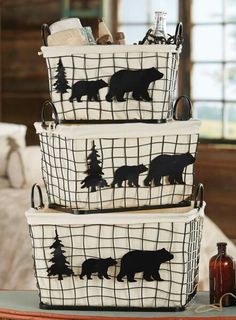 three baskets with bear silhouettes are stacked on top of each other