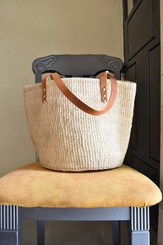 a large bag sitting on top of a chair