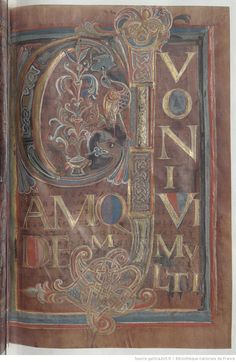 an old book with ornate designs and writing on it's cover, including the letter c