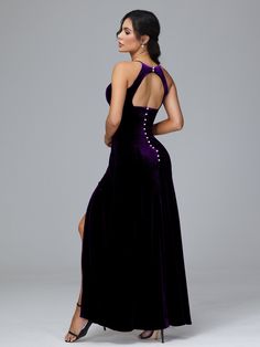 a woman in a purple dress is looking back