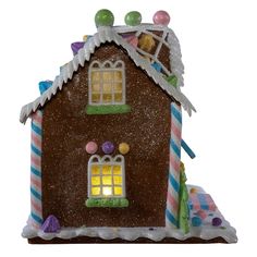 a gingerbread house with candy and candies on the roof is shown in front of a white background