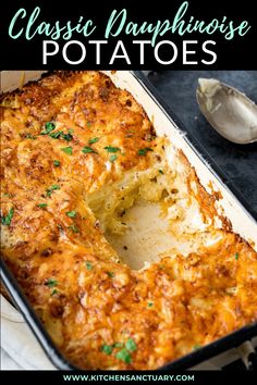 a casserole dish with cheese and parsley in it on a napkin next to a spoon