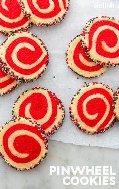 red and white cookies with sprinkles on top