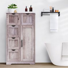 a bathroom with a sink, toilet and wooden cabinet in the corner next to a bathtub