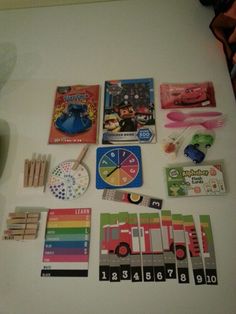 there are many different items on the table to be used as magnets and cards