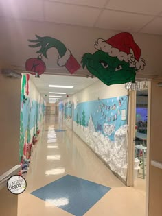 an empty hallway decorated for christmas with dr seuss and the grin