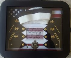 an american flag and medal in a shadow box