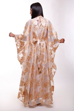 Turn heads in this mesmerizing floral Organza butterfly caftan dress, a true statement piece for the woman who loves to stand out. With its flowing butterfly sleeves and high neck design, this maxi-length beauty is perfect for black-tie events, luxurious resorts, or as an unforgettable wedding guest ensemble. Picture yourself twirling through a garden, or arriving at a fancy gathering with the vibrant floral gloss shimmering in the evening light. This dress is made for moments where elegance mee Cape Dresses For Evening Eid Celebrations, Evening Cape Dress For Eid, Festive Maxi Dress With Cape Sleeves, Luxury Festive Maxi Dress, Elegant Spring Kimono Maxi Length, Elegant Spring Maxi Length Kimono, Elegant Maxi Length Kimono For Spring, Silk Maxi Length Abaya, Spring Luxury Maxi Dress