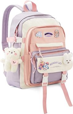 a pink and white backpack with hello kitty stickers on it