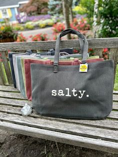 Salty Cotton Canvas Bag. Durable cotton canvas bag. Thick and cushioned 12 inches, shoulder length handles. Dimension: 22 inches in length and 14 inches tall, not including handle and 7 inches wide. Casual Canvas Tote Bag With Canvas Lining, Casual Canvas Tote Bag With Lining, Trendy Cotton Satchel Bag, Casual Canvas Bag With Canvas Lining, Casual Softback Canvas Shopping Bag, Casual Cotton Canvas Satchel Bag, Canvas Bags With Reinforced Double Handles, Casual Rectangular Canvas Bag With Canvas Lining, Casual Canvas Shopping Bag With Handles