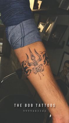 a man with a tattoo on his arm