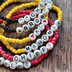 KC CHEIFS TEAM SPIRIT BRACELETS ARE A FUN MUST HAVE! Carefully handmade by us on our heavy duty elastic wire. This is a set of 3 including 1 red, 1 yellow, and 1 black bracelet. Using small glass seed beads are strung to 7.5 inches in length.   Please see customize section to personalize your bracelet with your favorite player or saying! If No customization is requested in PERSONALIZATION BOX,  wording may vary. Personalized Red Beaded Bracelets With Letter Beads, Red Adjustable Stretch Bracelet, Personalized, Red Adjustable Personalized Stretch Bracelet, Adjustable Personalized Red Stretch Bracelet, Personalized Red Name Bracelet With Letter Beads, Customized Adjustable Red Wristband, Red Customizable Adjustable Wristband, Adjustable Red Beaded Bracelets For Personalized Gift, Customizable Adjustable Red Wristband