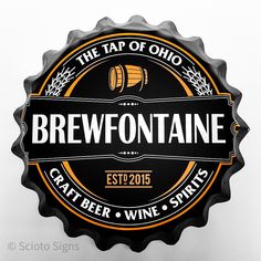 a beer bottle cap with the words brewontaine on it and an image of a barrel