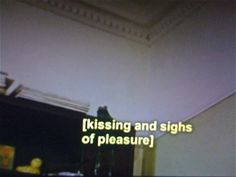 the words kissing and signs of pleasure written on a wall