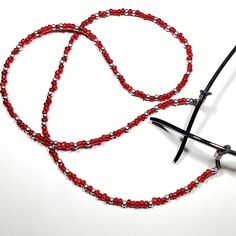 Enhance Your Eyewear With Our Handmade Red And Silver Beaded Eyeglass/Sunglasses Chain Holder, A Dazzling Accessory Designed For Both Style And Practicality. This Eyeglass/Sunglasses Holder Boasts A Variety Of Beads In Vibrant Reds And Shimmering Silver Tones, Accented With Red Faceted Glass Beads For An Extra Touch Of Sparkle. Complemented By Black Adjustable Eyeglass Holders, This 28-Inch Chain Is Made On Strong And Durable Beading Wire. Elevate Your Look With Eye-Catching Colors And A Versati Armani Glasses, Tom Ford Glasses, Tortoise Glasses, Eyeglass Necklace, Glasses Chains, Sunglasses Chain, Sunglasses Holder, Vision Glasses, Gold Glasses