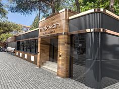 a rendering of the entrance to a restaurant with wood and metal sidings on it