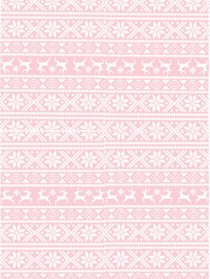 a pink and white knitted pattern with snowflakes