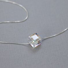 Tiny Swarovski Crystal cube bead on sterling silver box necklace chain Necklace length :  See sizing guide and select preference from drop down list See second photo for size reference Cube pendant measures 6mm x 6mm. Cube also available in 8mm x 8mm: https://www.etsy.com/listing/190705753/swarovski-cube-necklace-sterling-silver COMES CAREFULLY AND BEAUTIFULLY GIFT PACKAGED.  MORE FROM ALEXANDREASJEWELS: https://www.etsy.com/shop/alexandreasjewels SEE FAQ's below for shipping policy details Silver Necklace Layering, Xoxo Necklace, Necklaces Layered, Birthday Necklace Gift, Cube Necklace, Pretty Jewelry Necklaces, Casual Necklaces, Layered Necklaces Silver, Necklace Layering