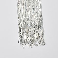 silver tinsel fringe on white background