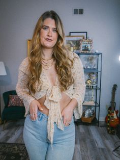 Trying to add to your Fleetwood Mac inspired wardrobe? Look no further than our brand new floral wrap blouse!- Features long bell sleeves with a tie-front- Soft and lightweight, super semi-sheer material- Fits true to size | Model is 5'9" wearing a size M - Paired here with our 90's Wide Leg Jeans**due to screens & filters color may vary from pictures** Feminine Bell Sleeve Blouse, Spring Bell Sleeve Tops With Tie Sleeves, Summer Floral Embroidered Bell Sleeve Blouse, 90s Bell Sleeve Tie Front Textured Sheer Top, Oversized Floral Print Button-up Blouse, Sheer Material, Floral Wraps, Wrap Blouse, Fleetwood Mac