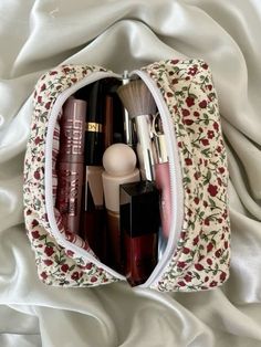 @virgomaii Classy Makeup Bag, Floral Makeup Pouch, Hairstyle Kids Girl, Inside My Makeup Bag, Aesthetic Makeup Bag, Red Makeup Bag, Makeup Bag Aesthetic, Floral Makeup Bag, Mini Makeup Bag