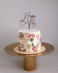 a floral birthday cake with a happy birthday candle on top that reads, happy birthday