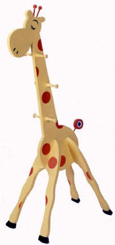 a wooden giraffe with red spots on it's body