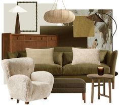 a living room scene with focus on the couch and chair, lamps, rugs and artwork